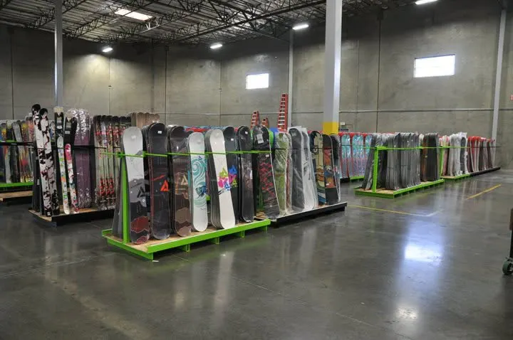 Racks of snowboards inside the original Brand Warehouse retail shop