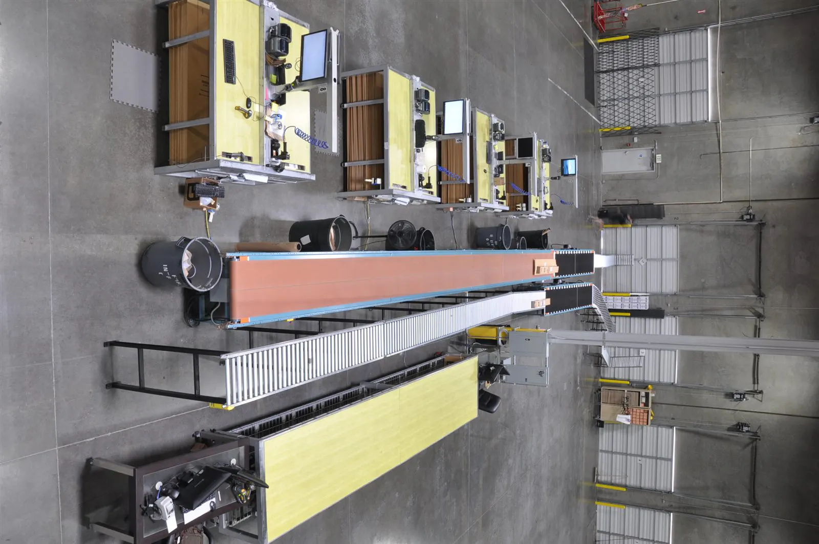 Packing workstations and conveyor lanes inside the Brand Warehouse facility