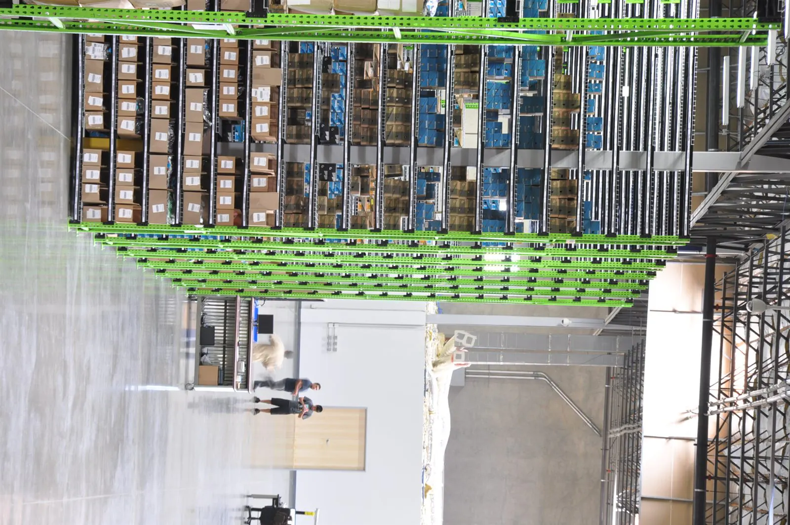 Long view across organized shelving and inventory inside the warehouse